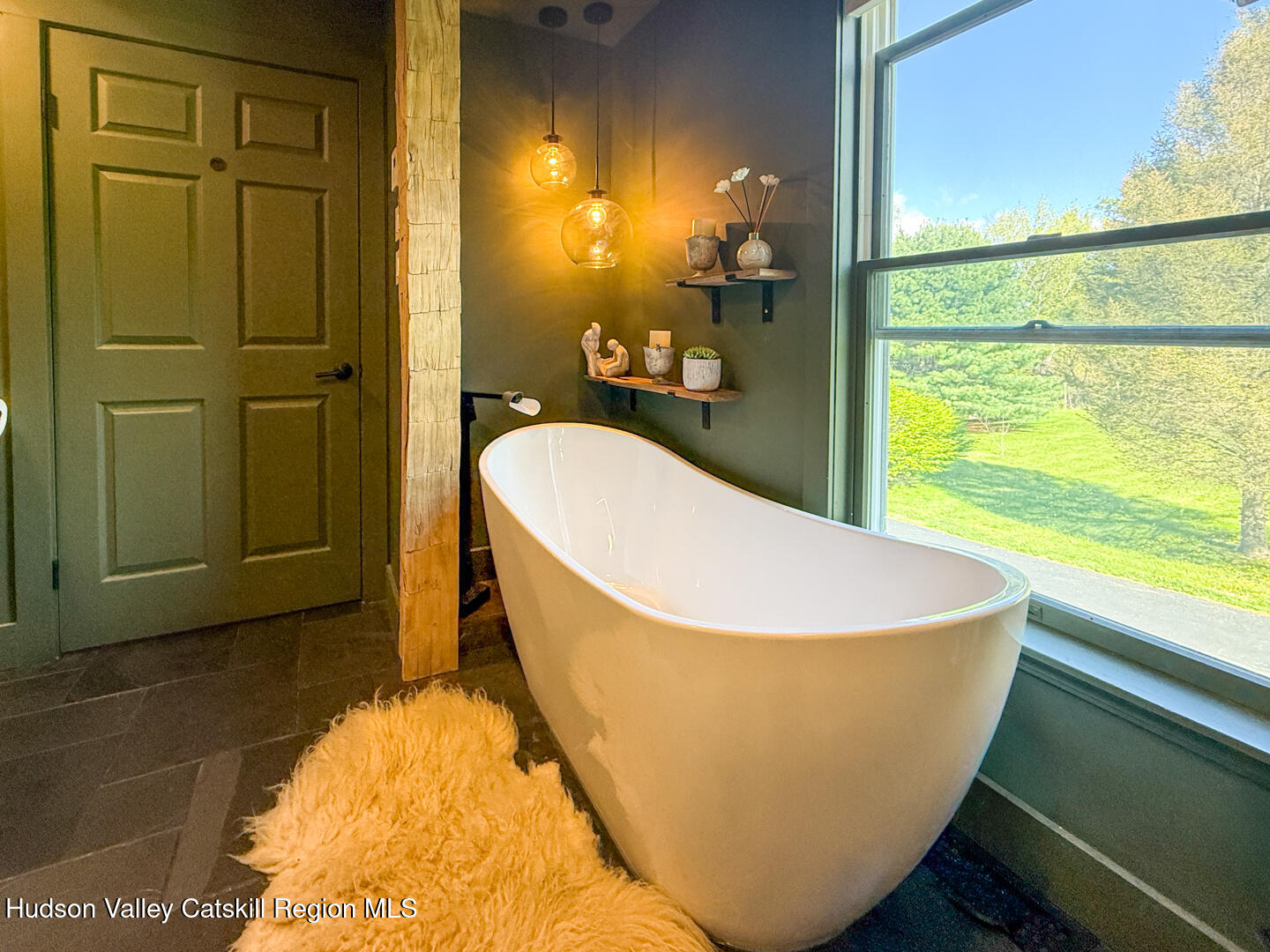 787 Co Rte 6 Germantown, NY 12526 - Photo 16 of 35 a white tub sitting in a bathroom next to a window