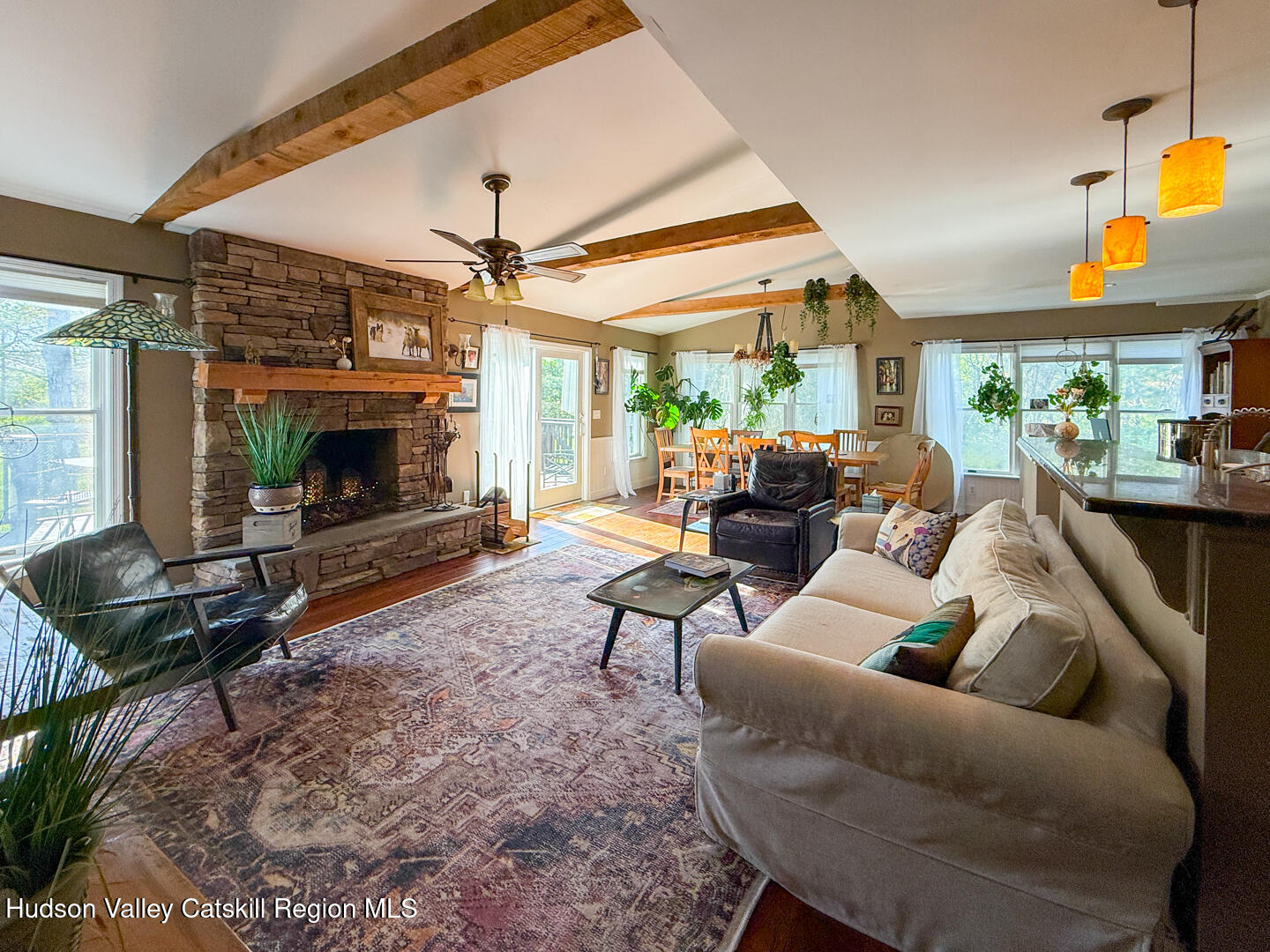 787 Co Rte 6 Germantown, NY 12526 - Photo 3 of 35 a living room with furniture a fireplace and a table