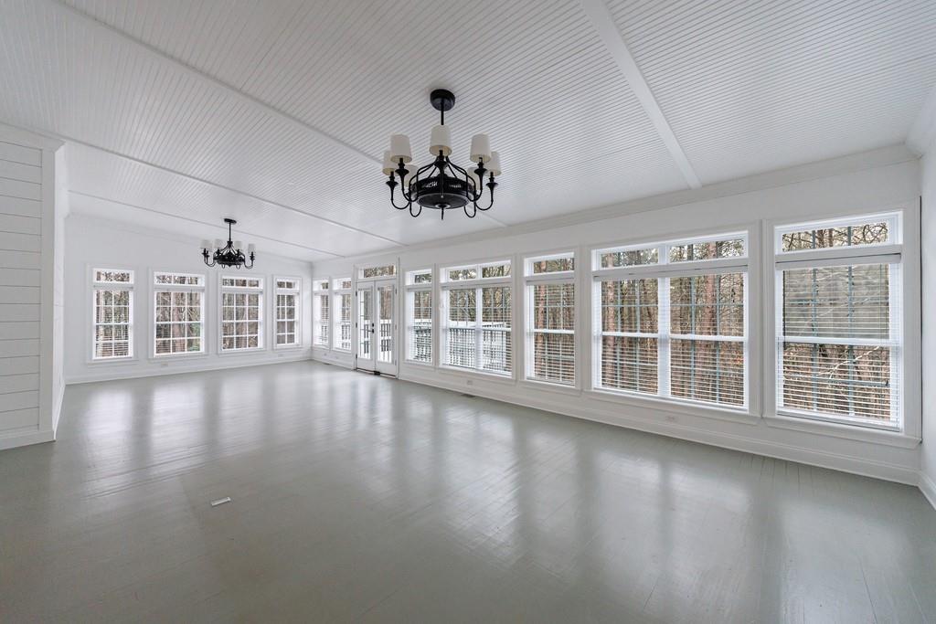 267 Sharp Mountain Parkway Jasper, GA 30143 - Photo 11 of 55 a view of an empty room with wooden floor and a window