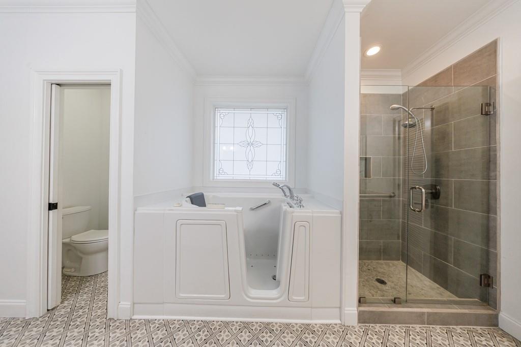 267 Sharp Mountain Parkway Jasper, GA 30143 - Photo 19 of 55 a bathroom with a shower a toilet and a sink