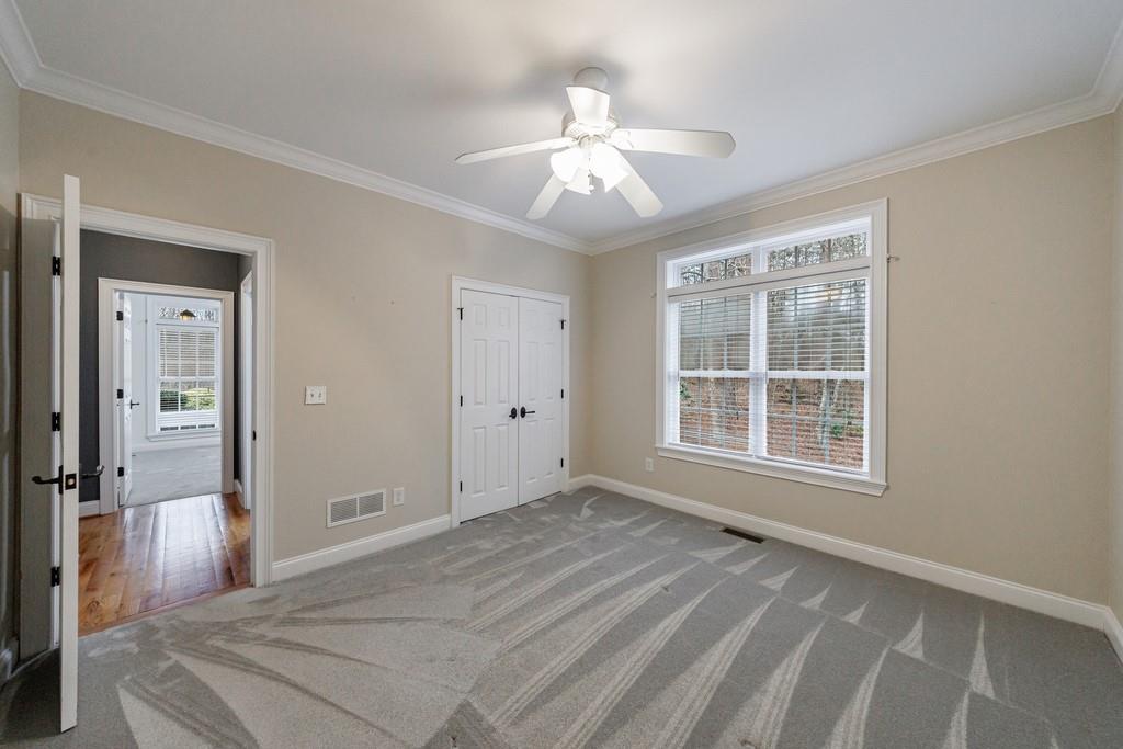 267 Sharp Mountain Parkway Jasper, GA 30143 - Photo 27 of 55 a view of a livingroom with a chandelier fan and windows