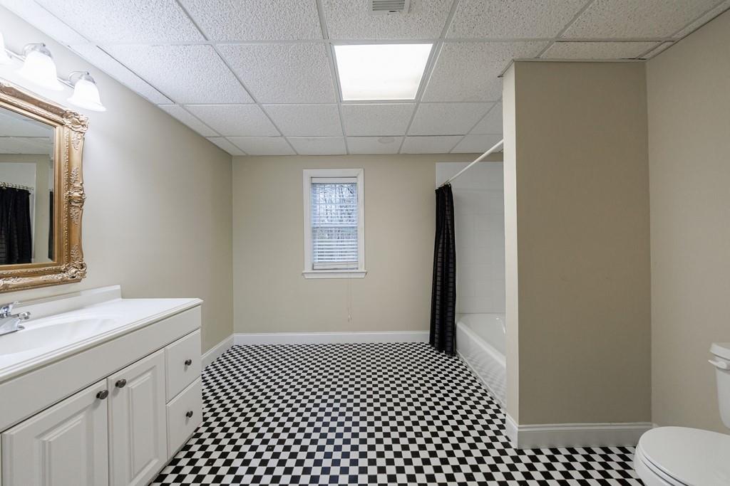 267 Sharp Mountain Parkway Jasper, GA 30143 - Photo 34 of 55 a bathroom with a sink a toilet a mirror and shower