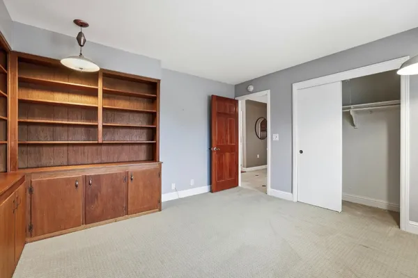 a kitchen with stainless steel appliances granite countertop a refrigerator a stove and a sink