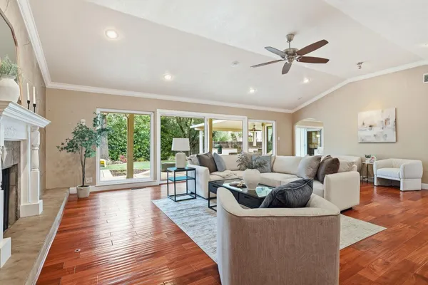 a view of a house with backyard porch and sitting area