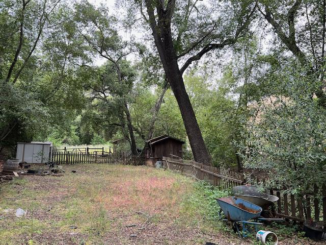 1011 Metcalf Road San Jose, CA 95138 - Photo 19 of 28 a backyard of a house with barbeque oven and a table and chairs