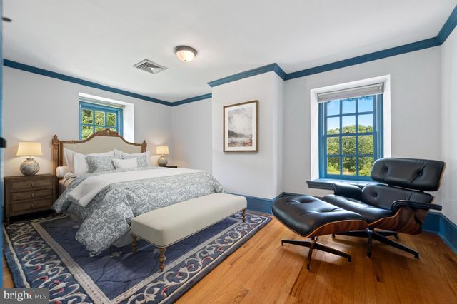 a bedroom with bed and cabinets