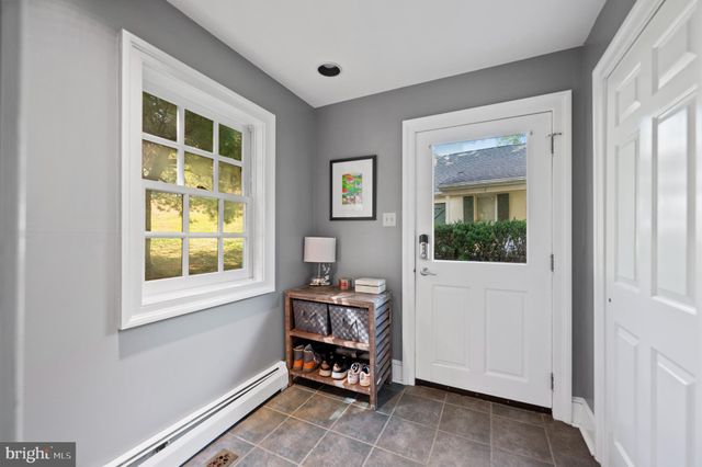 a room with lots of furniture and view of living room