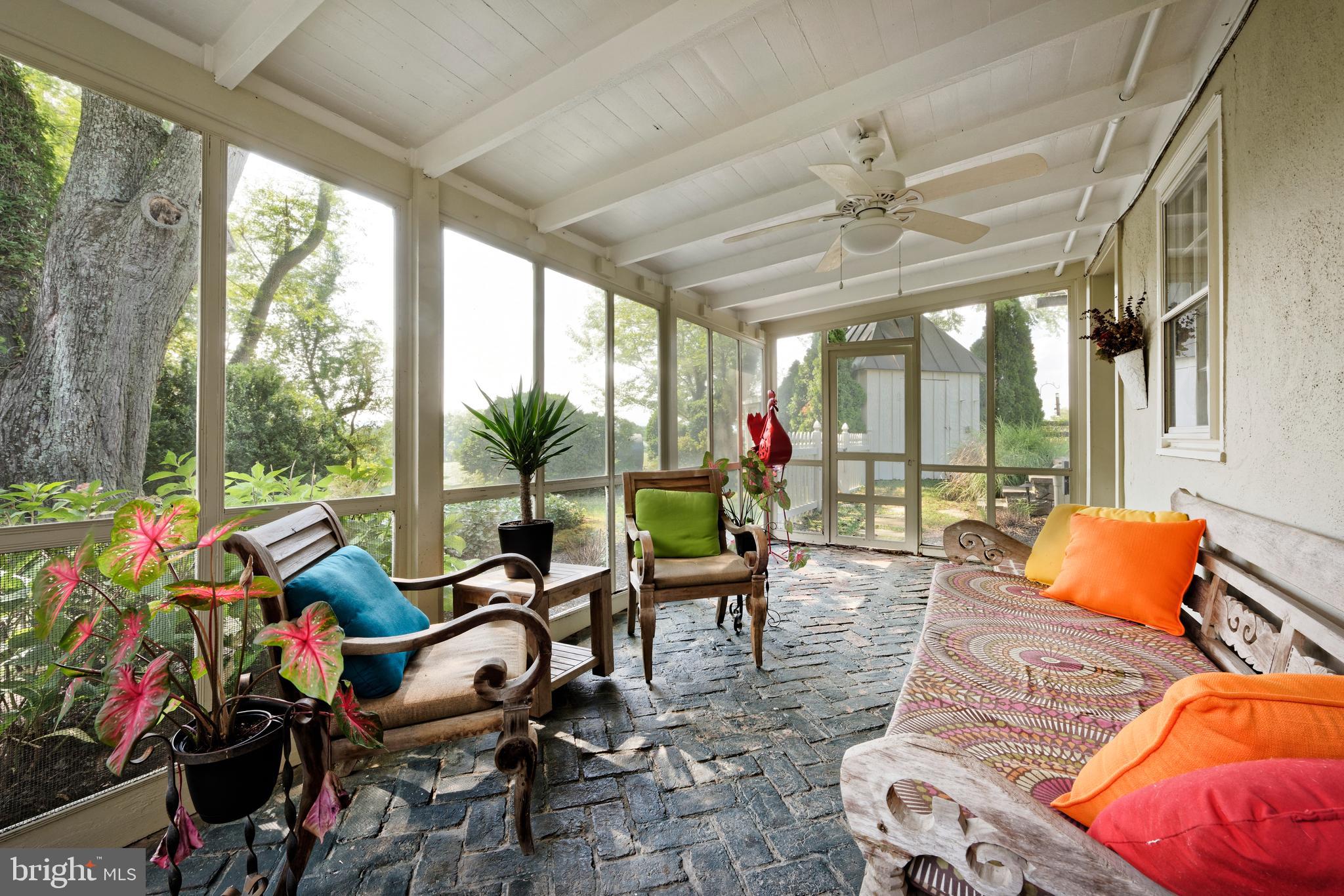22780 Foxcroft Road Middleburg, VA 20117 - Photo 23 of 41 View of the side screened porch w/brick flooring