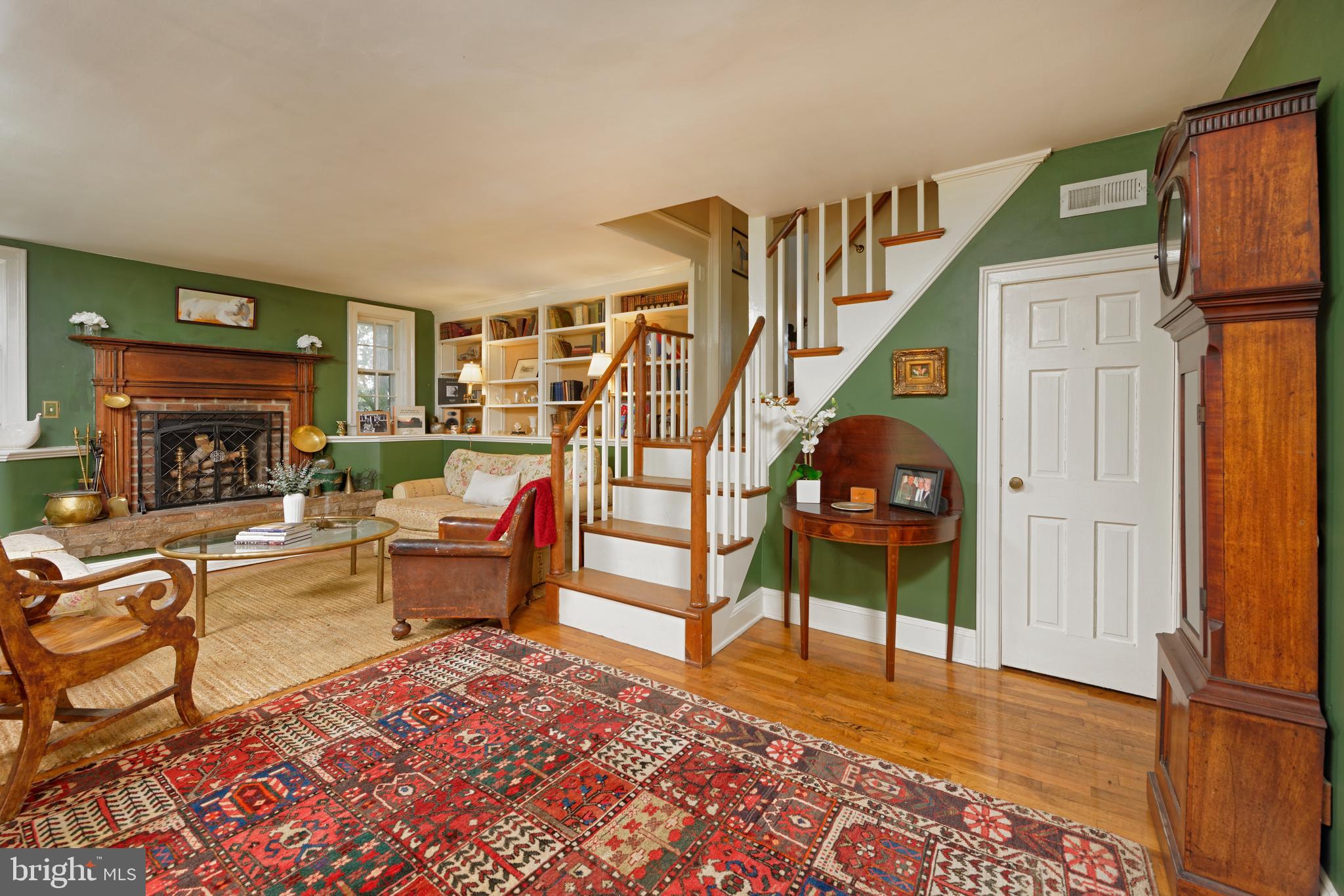 22780 Foxcroft Road Middleburg, VA 20117 - Photo 9 of 41 Formal living room with fireplace and bookshelves