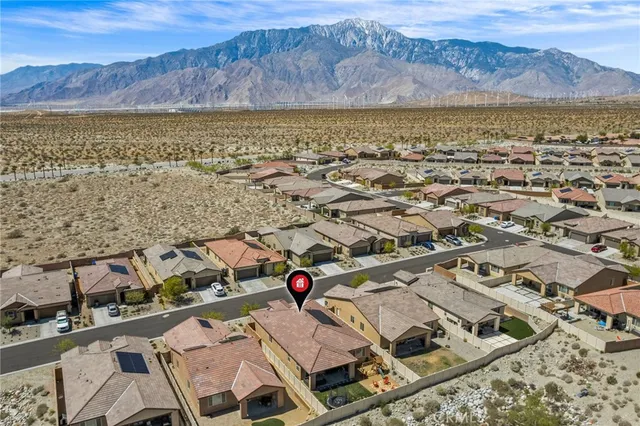 an aerial view of residential house with an outdoor space