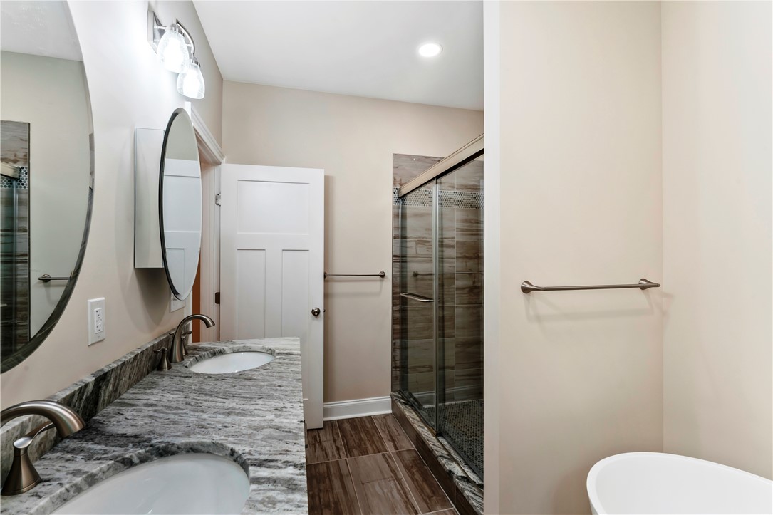 110 Gabriel Way Pickens, SC 29671 - Photo 21 of 48 Luxurious bathroom offering a spacious dual vanity, separate shower, and elegant tile flooring.