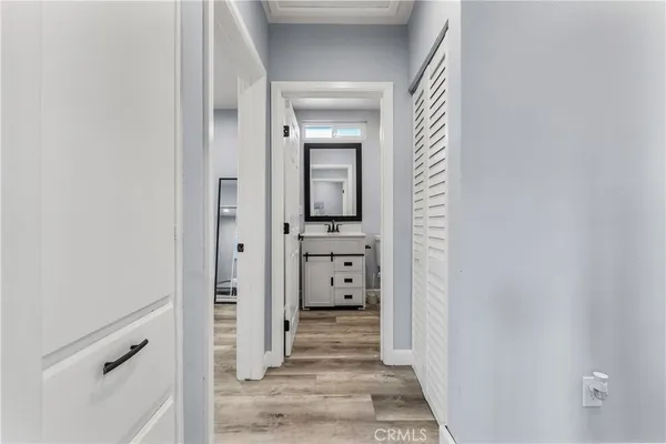 a bathroom with a granite countertop sink a toilet and a mirror