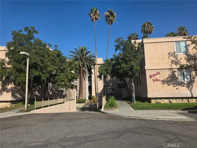 a view of a street with a building in the background