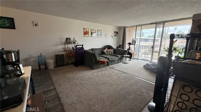 a living room with furniture fireplace and flat screen tv