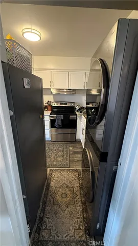 a view of storage and utility room with washer and dryer