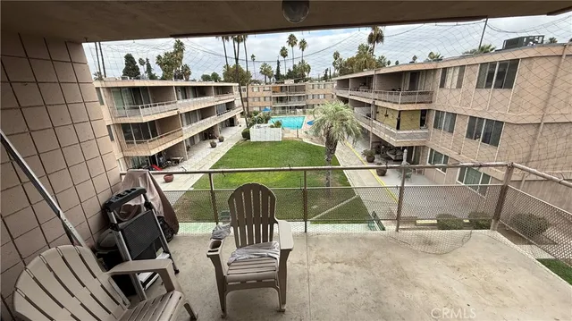 a view of a balcony with chairs