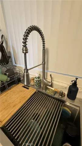 a kitchen with stainless steel appliances granite countertop a refrigerator and a stove