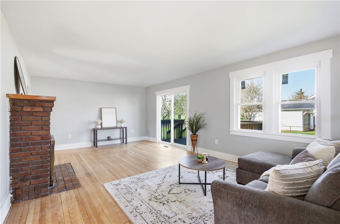 1925 Sunset Avenue Springfield, OH 45505 - Photo 11 of 45 This bright living space features abundant natural light, a brick fireplace, and gleaming hardwood floors.