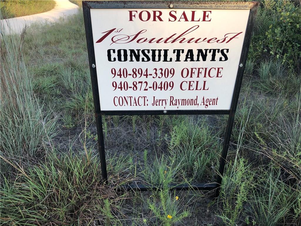 0 Starr Mann Road St. Jo, TX 76265 - Photo 12 of 12 a sign broad in front of the red brick house