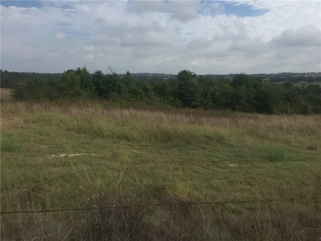 a view of a lake with houses in the back