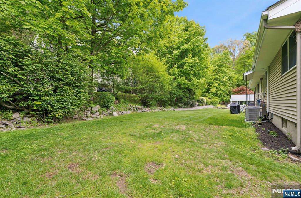 6 Waters Edge Butler, NJ 07405 - Photo 20 of 28 a view of yard with green space