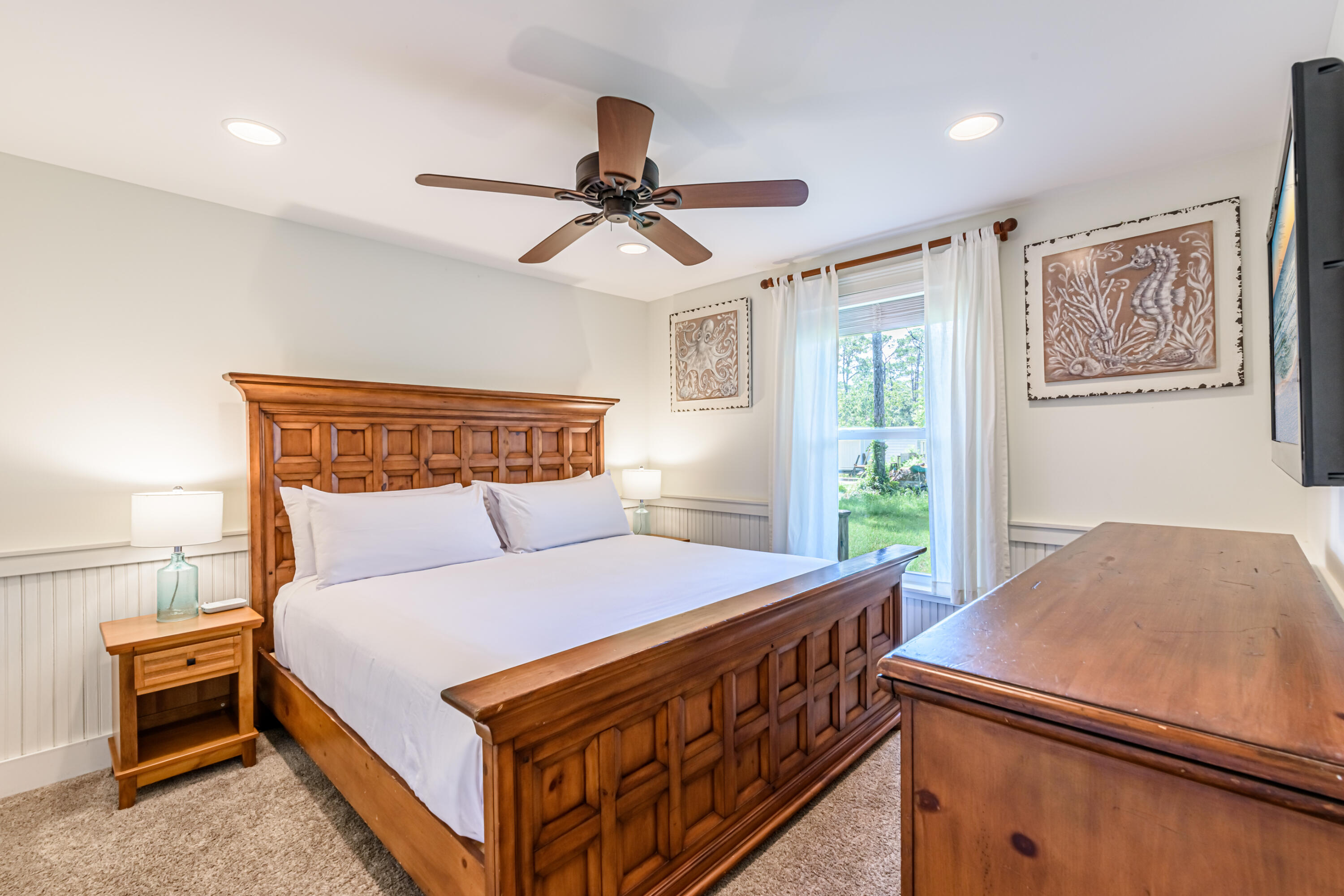 281 Elm Street Santa Rosa Beach, FL 32459 - Photo 19 of 37 a bedroom with a bed and a ceiling fan