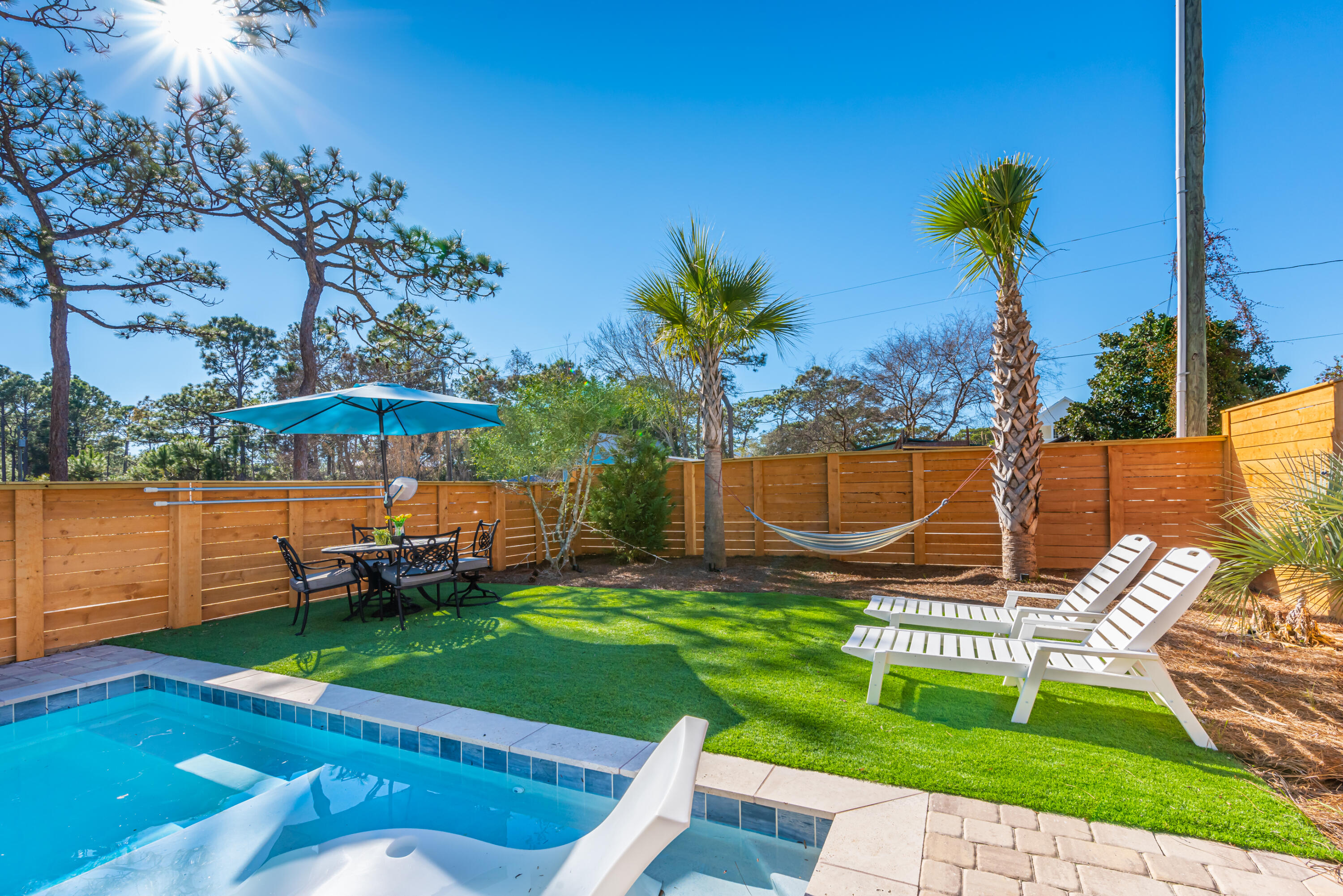 281 Elm Street Santa Rosa Beach, FL 32459 - Photo 2 of 37 a view of a backyard with a garden