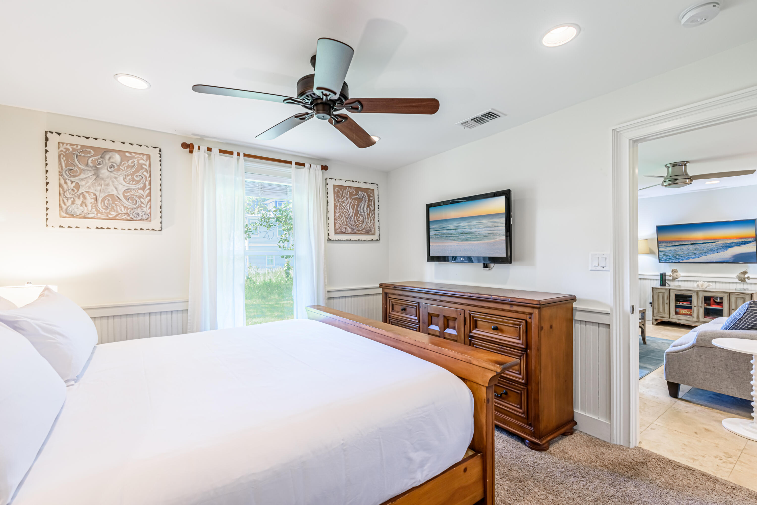 281 Elm Street Santa Rosa Beach, FL 32459 - Photo 21 of 37 a bedroom with a bed and a chandelier