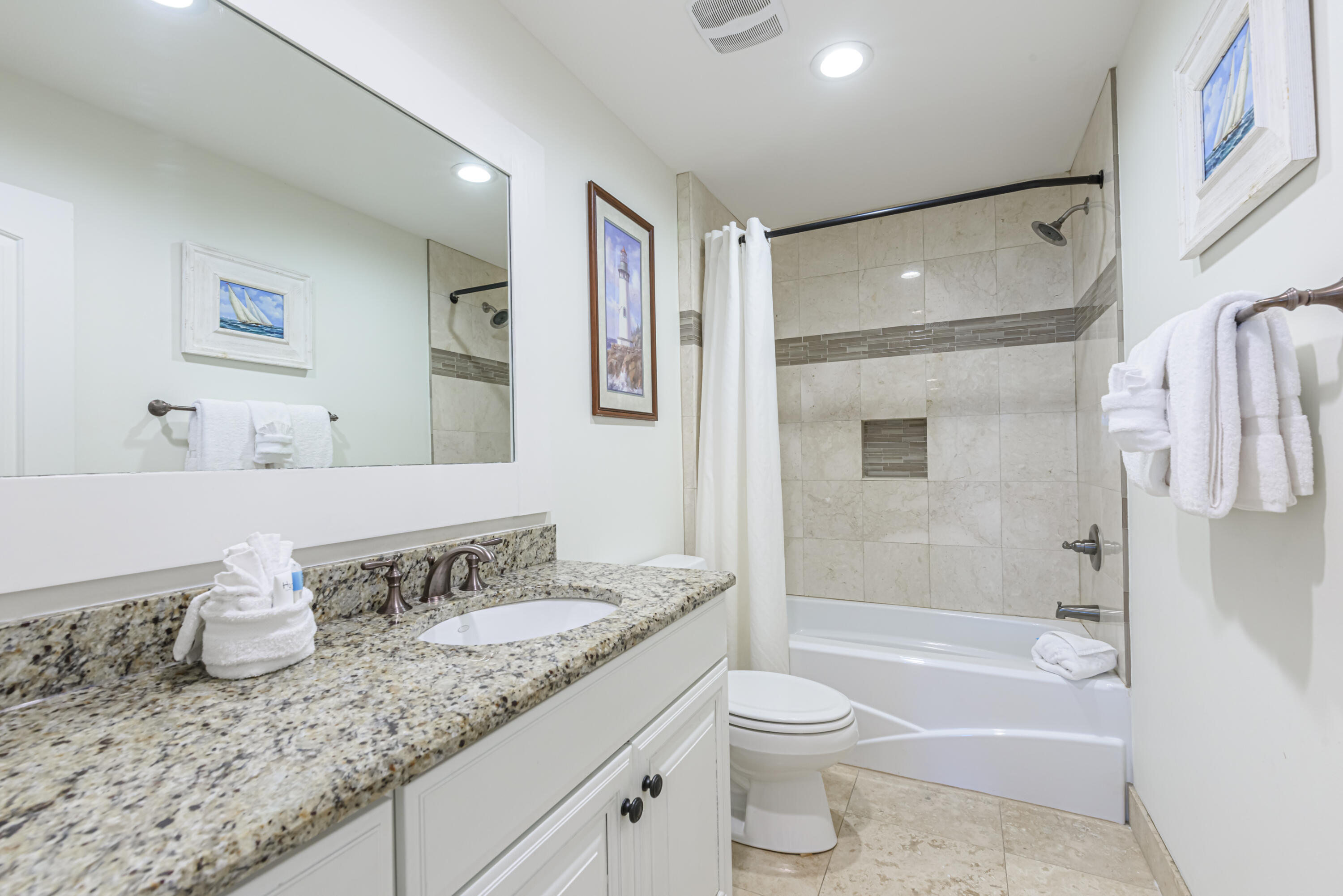 281 Elm Street Santa Rosa Beach, FL 32459 - Photo 24 of 37 a bathroom with a granite countertop sink toilet and shower
