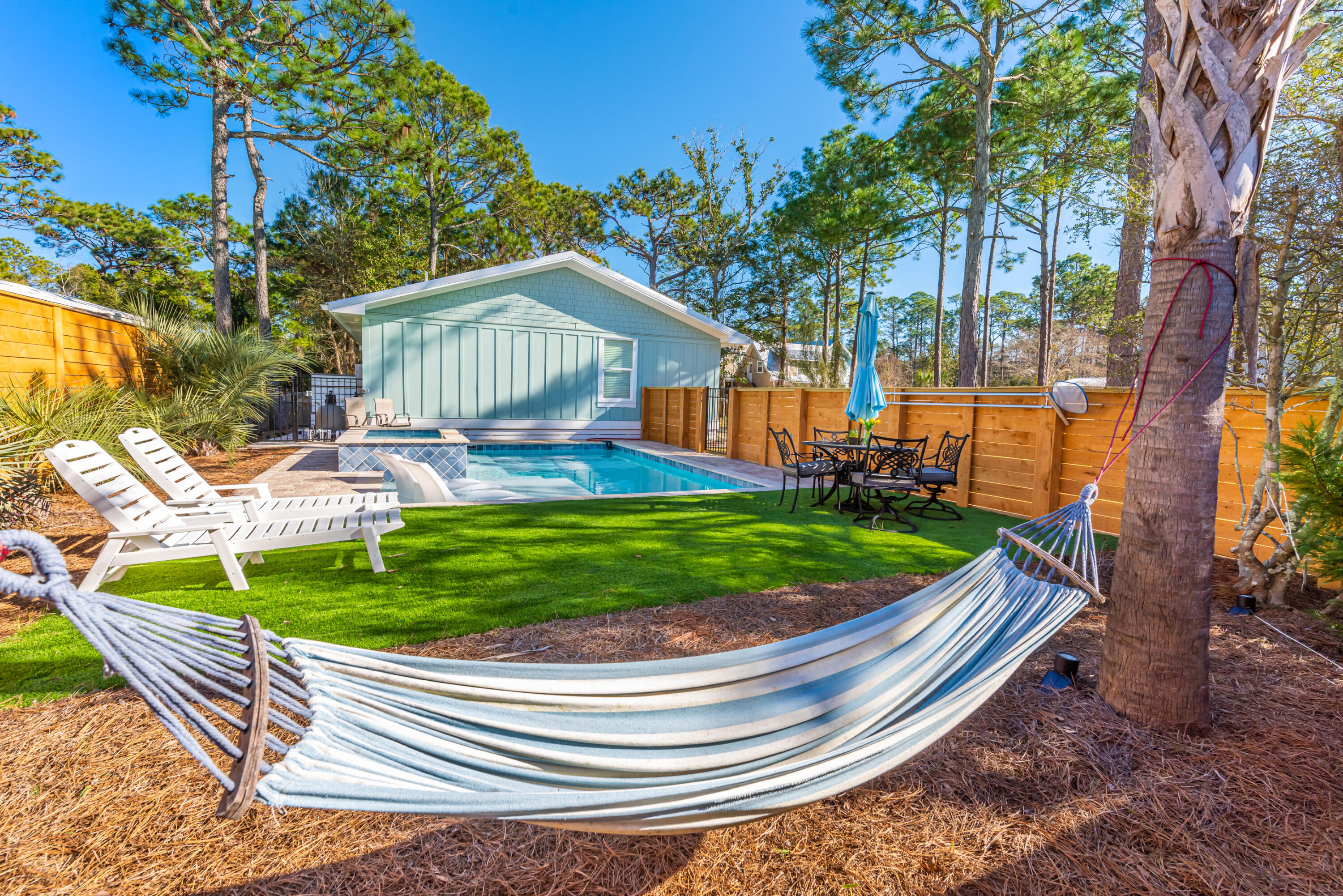 281 Elm Street Santa Rosa Beach, FL 32459 - Photo 27 of 37 a small garden covered with tall trees