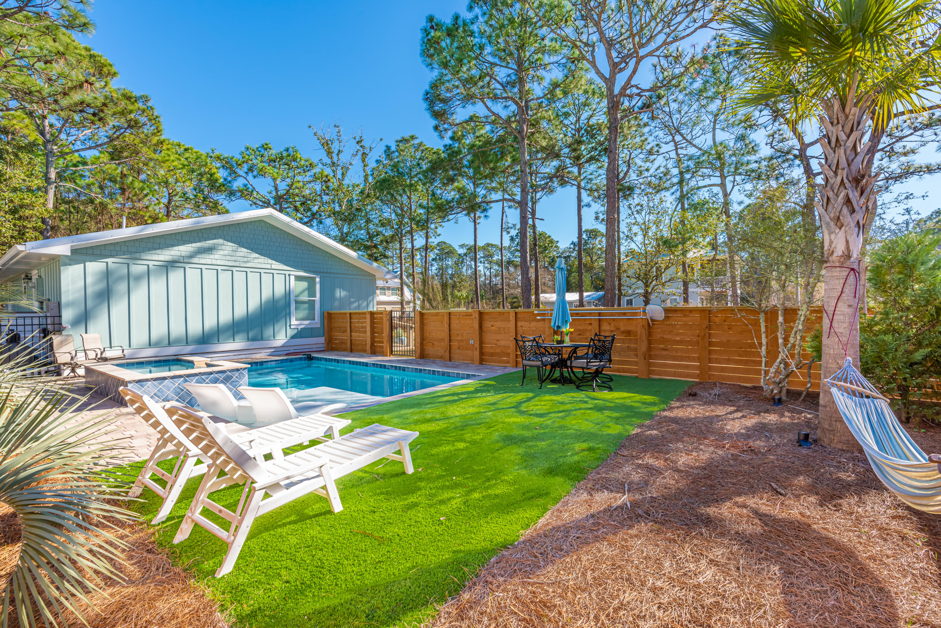 281 Elm Street Santa Rosa Beach, FL 32459 - Photo 28 of 37 a view of backyard with deck and garden