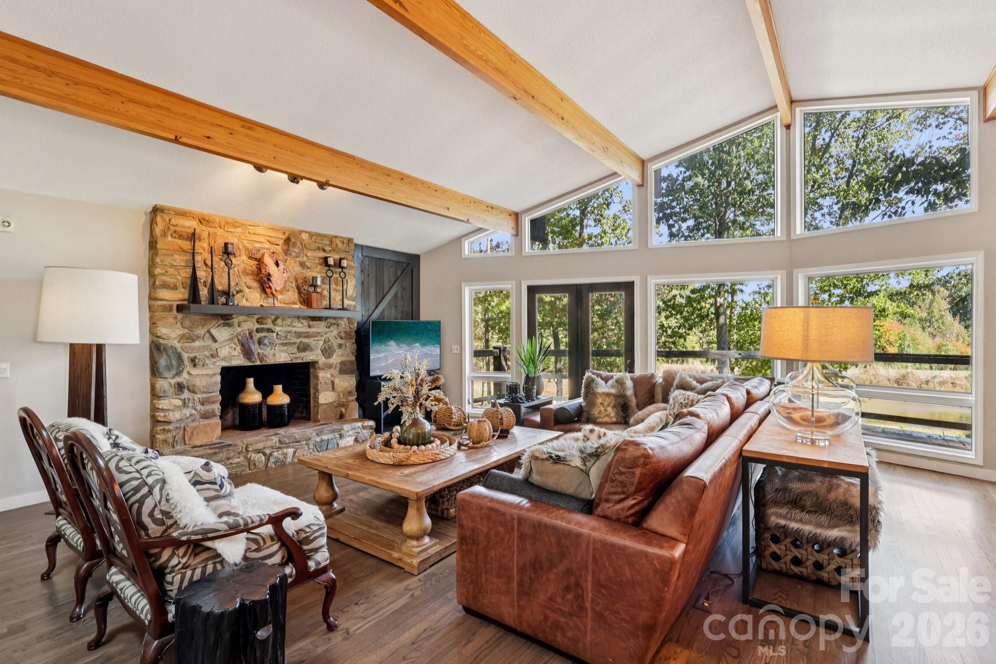 44333 Stony Gap Road Albemarle, NC 28001 - Photo 12 of 28 a living room with fireplace furniture and a large window