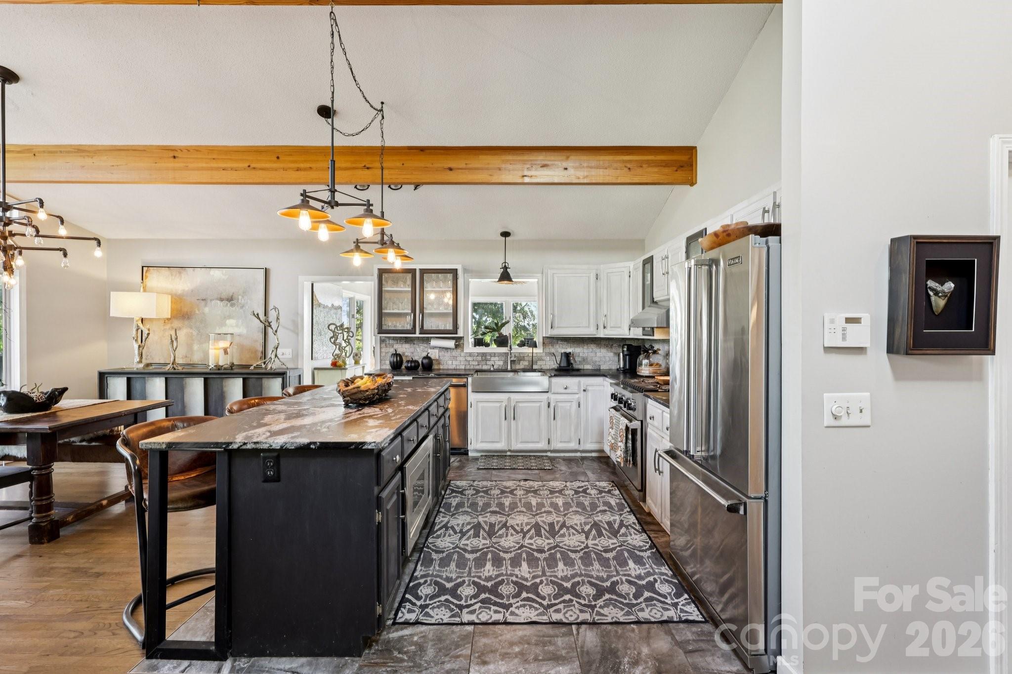 44333 Stony Gap Road Albemarle, NC 28001 - Photo 15 of 28 a kitchen with stainless steel appliances granite countertop a sink stove and refrigerator
