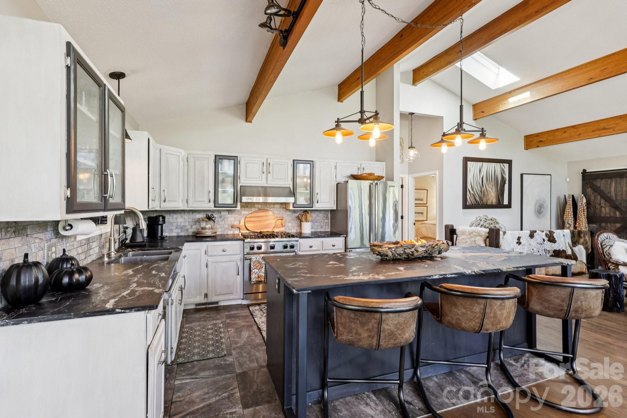 44333 Stony Gap Road Albemarle, NC 28001 - Photo 16 of 28 a kitchen with sink a stove and chairs