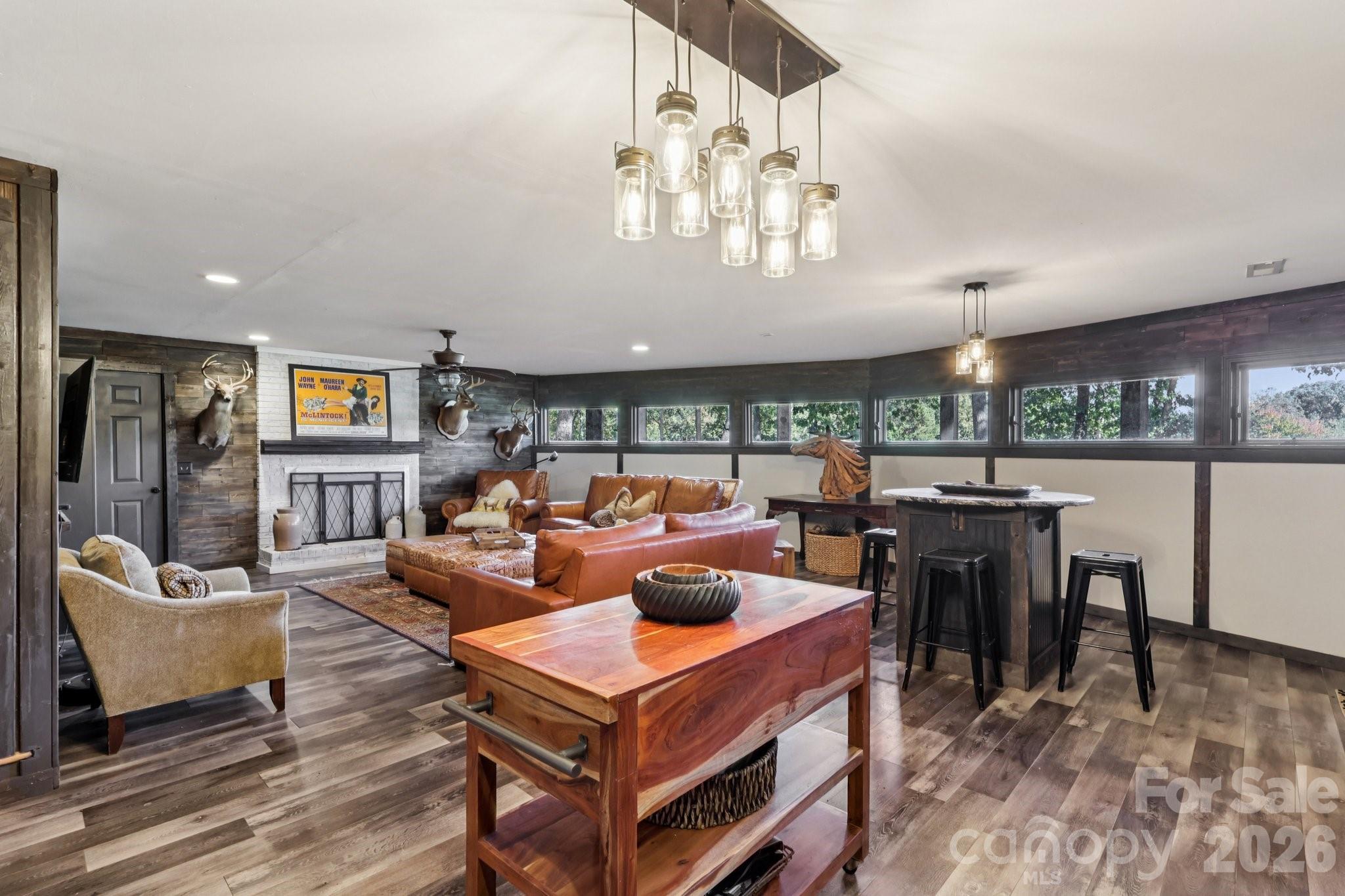 44333 Stony Gap Road Albemarle, NC 28001 - Photo 21 of 28 a living room with furniture a chandelier and a large window