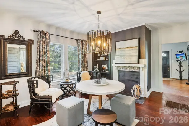 a dining room with a table and chairs
