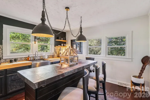 a kitchen with a sink and a window