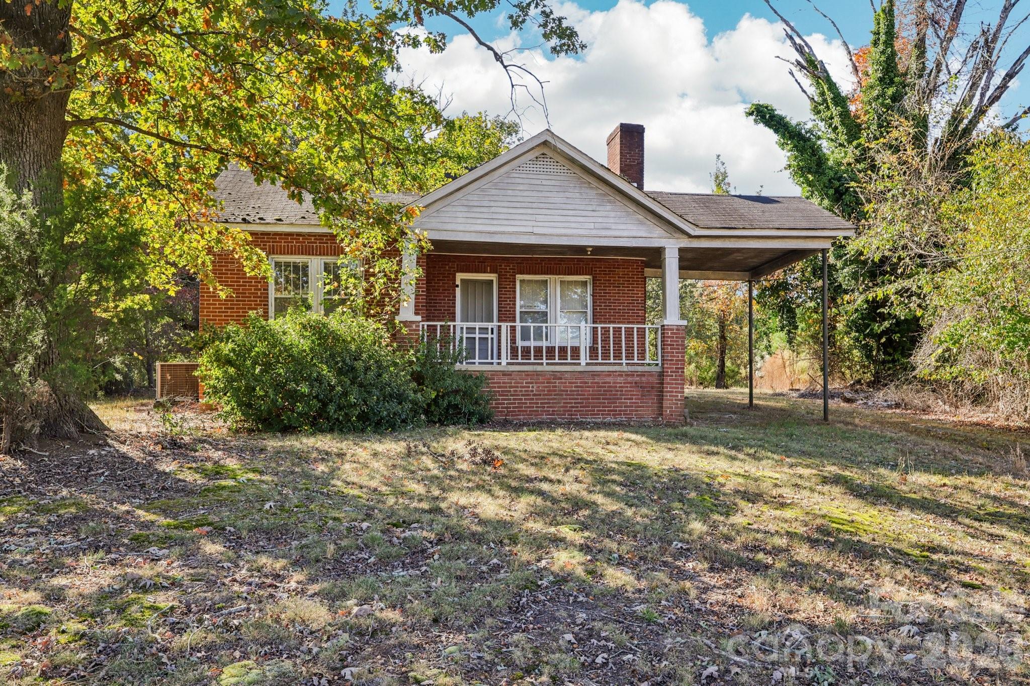 44333 Stony Gap Road Albemarle, NC 28001 - Photo 28 of 28 a front view of a house with a garden