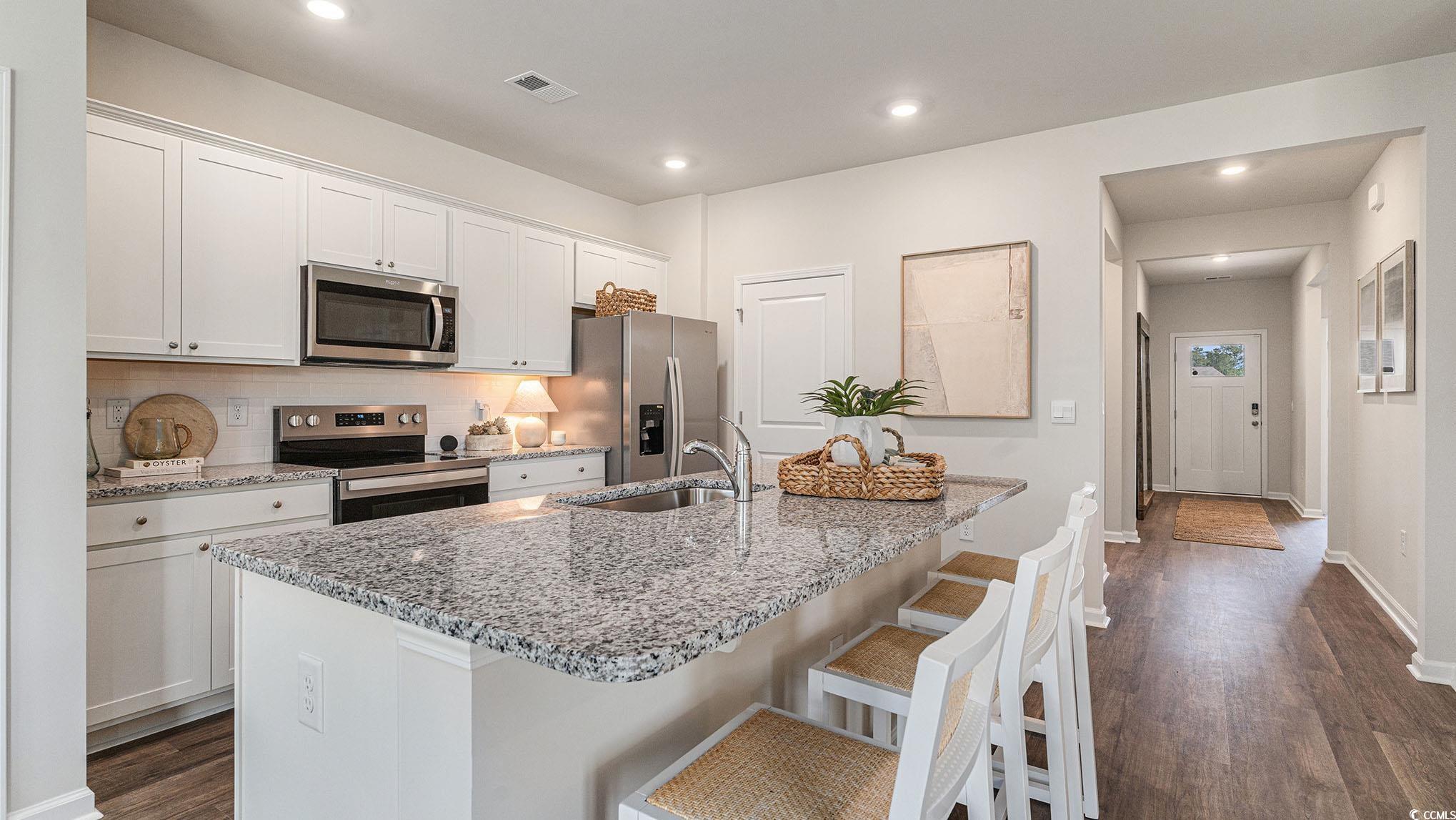 128 Dagger Court Myrtle Beach, SC 29588 - Photo 4 of 22 Kitchen featuring stainless steel appliances, a si