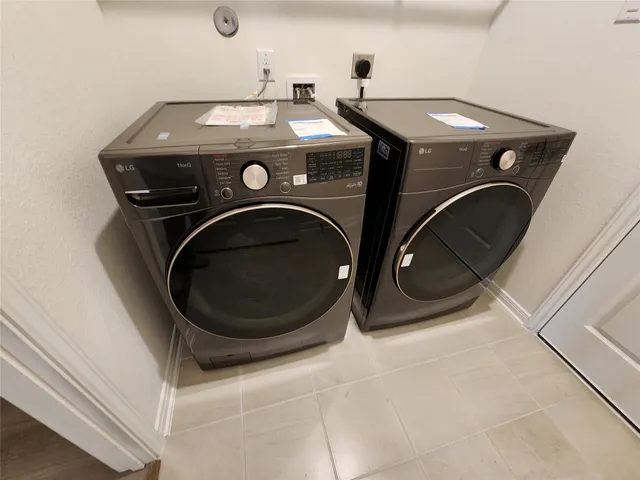a view of a refrigerator in kitchen and a wooden floor