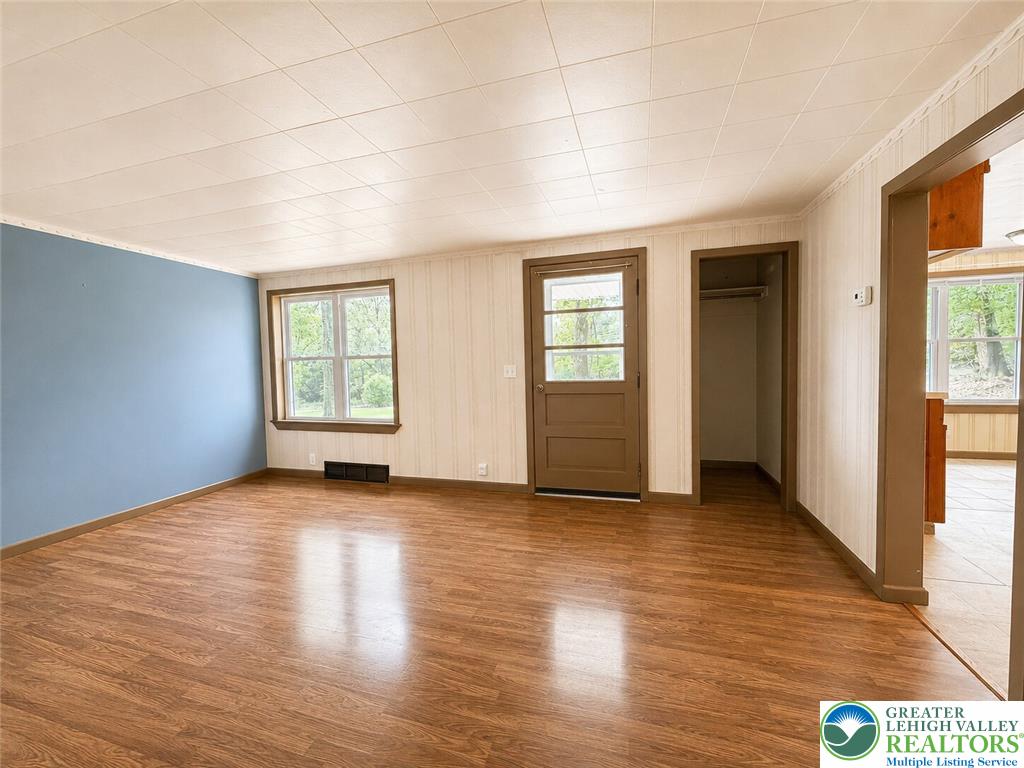 4995 Mountain Road Slatington, PA 18080 - Photo 5 of 30 A versatile living space, this room offers warm wood flooring and a view of the outdoors.
