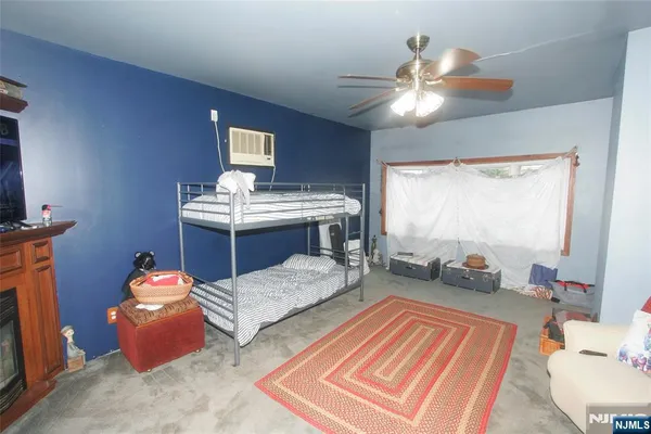 a bed room with a bed and a chandelier