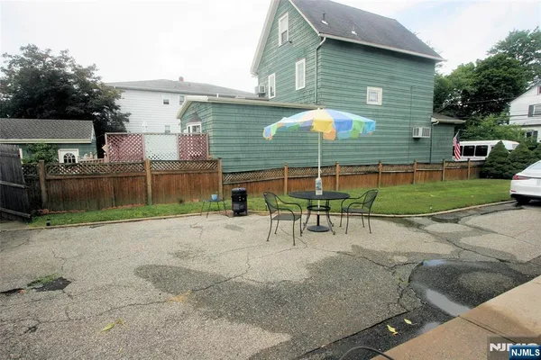 a view of a backyard with a patio