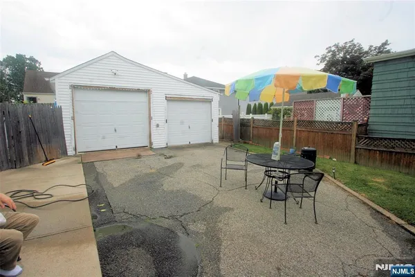 a patio with a table and chairs