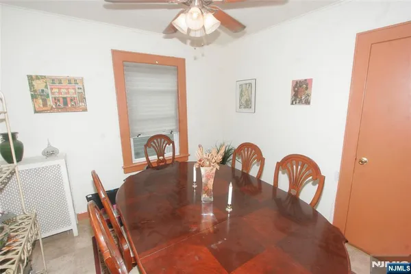 a dining room with furniture and window