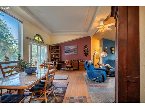 a living room with furniture a window and a chandelier
