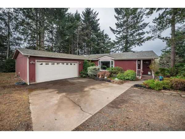 a view of garage and yard