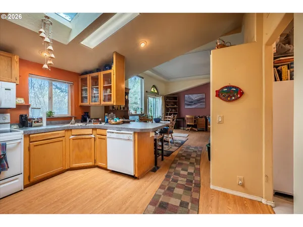a kitchen with stainless steel appliances granite countertop a sink and cabinets