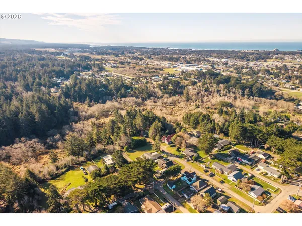 an aerial view of residential building and trees around
