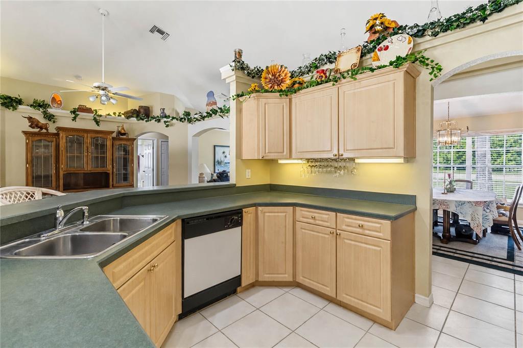 3225 Canoe Creek Road St. Cloud, FL 34772 - Photo 11 of 30 a kitchen with a sink cabinets and window